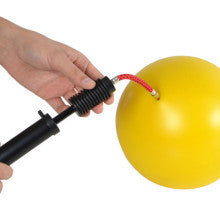 Dual action sports ball pump with flexible needle extension for easier operation.