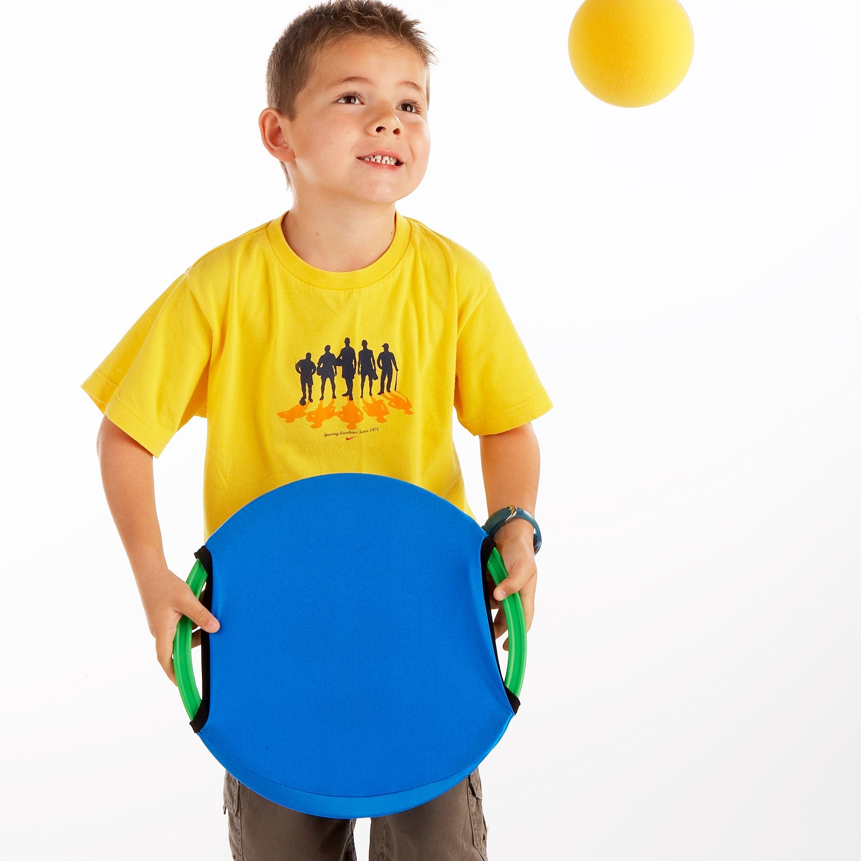 Early Years Coaching Aid. The reverse of the Easy Catch Happy Face is smooth and more challenging. Here, Owen shows how to volley using a sponge ball.