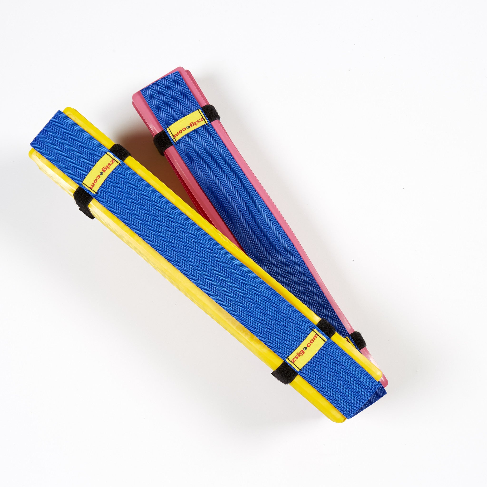 Pink & yellow sets of Throw down lines packed in their easy-to-carry harnesses.
