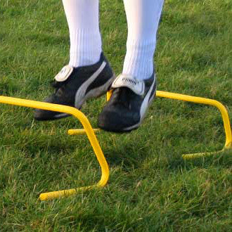 Mini hurdle in football fitness training. 15cm height.