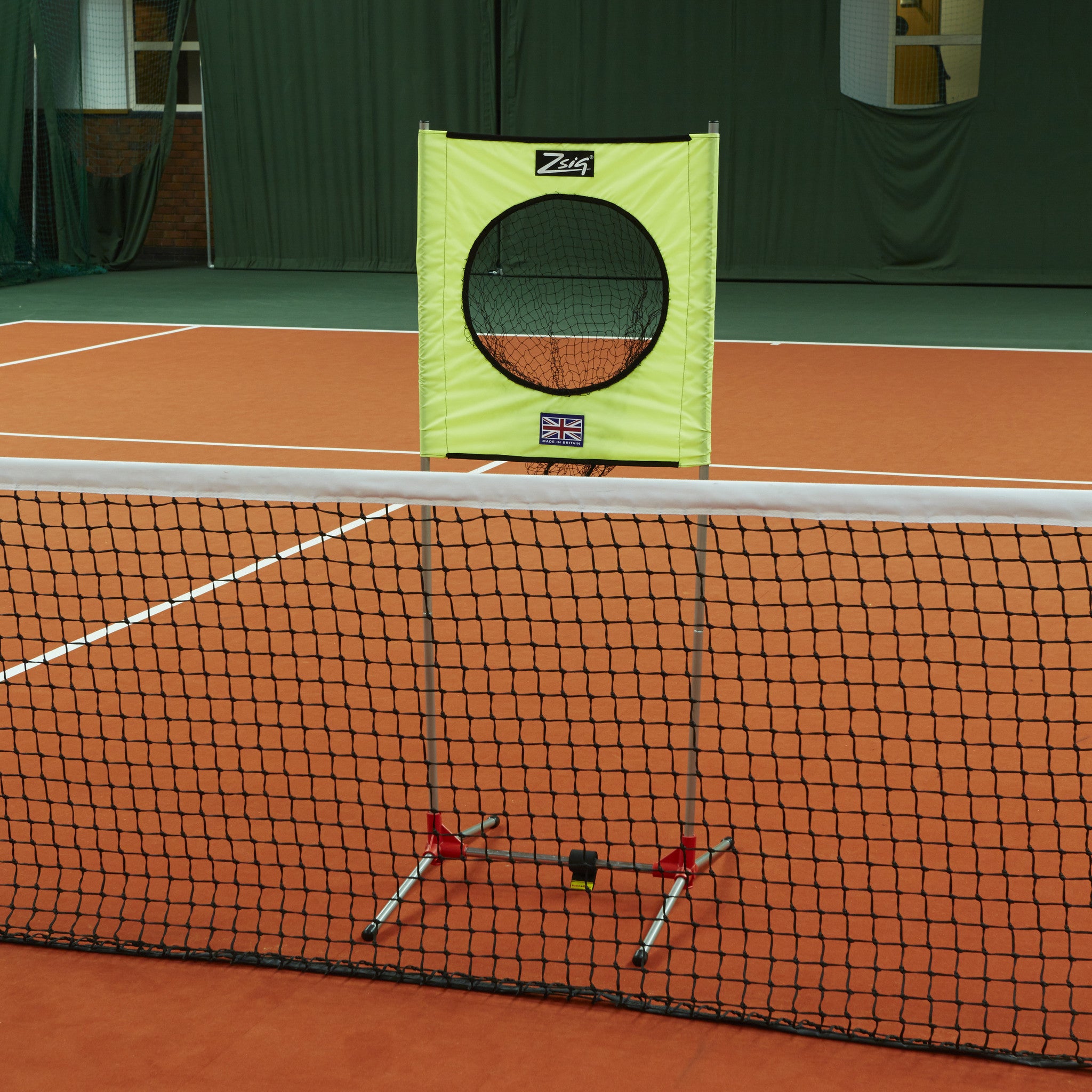 Zsig portable Target trainer in position behind a full-size tennis net.