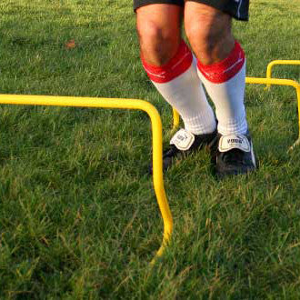 Mini hurdle in football fitness training. 30cm height.